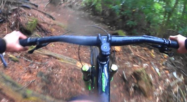 advanced level cyclist going thru the forest  Resampled. POV from helmet